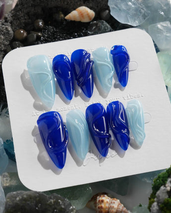 Majorelle Blue sculpted swirl nails with architectural gel lines and lacquer-like finish