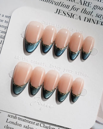 Malta Blue close-up of midnight blue French manicure with luminous cat-eye depth