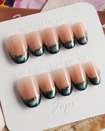 Malta Blue glossy almond nails with deep blue cat-eye shimmer and clean gold border