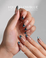Malta Blue medium almond press-ons with rich blue cat-eye tips and soft nude contrast