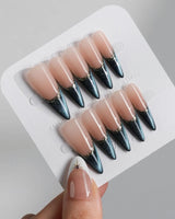 Malta Blue long stiletto nails with glowing blue cat-eye tips and gold French edging