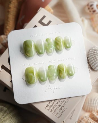 Matcha Chill extra short oval press-on nails with soft jade green marble finish