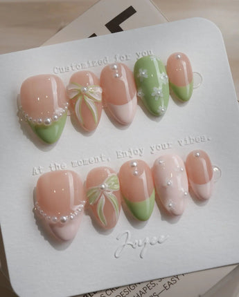 Matcha Ribbon press-on nails in extra short almond shape — Fresh Jelly Green, 3D Bows & French Pearl Outlines.