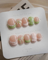 Matcha Ribbon press-on nails in extra short squoval shape — Fresh Jelly Green, 3D Bows & French Pearl Outlines.