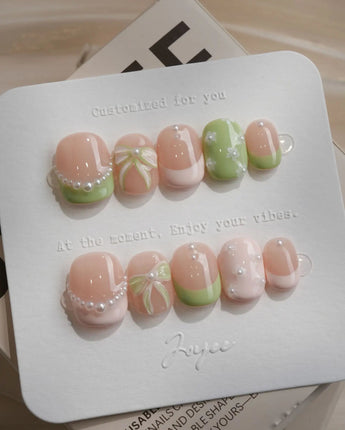 Matcha Ribbon press-on nails in extra short squoval shape — Fresh Jelly Green, 3D Bows & French Pearl Outlines.