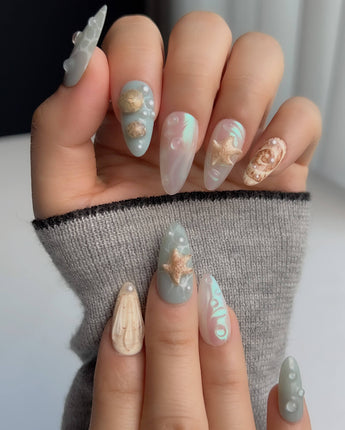 Mauritius Escape medium almond nails with glossy mint waves and 3D sea elements