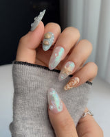 Mauritius Escape medium almond press-on nails with mint shimmer and sculpted starfish