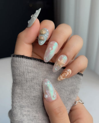 Mauritius Escape medium almond press-on nails with mint shimmer and sculpted starfish