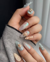 Mauritius Escape medium almond beach nails with pearly mint, conch shell texture, and starfish accents
