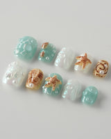 Mauritius Escape extra short squoval nails with pearly mint sea elements and bubbles