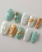 Mauritius Escape medium oval nails with pearly mint base and sculpted sea details
