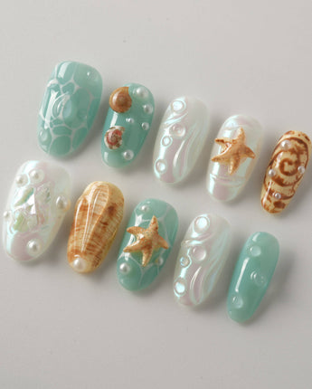 Mauritius Escape medium oval nails with pearly mint base and sculpted sea details