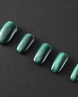 Emerald Green Nail Designs Cat-eye Nails press-on nails in medium oval shape — emerald green cat eye nails