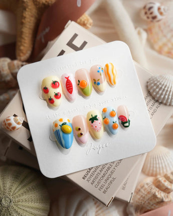 Mercato maximalist 3D press-on nails in butter yellow, pistachio, blue, and blush