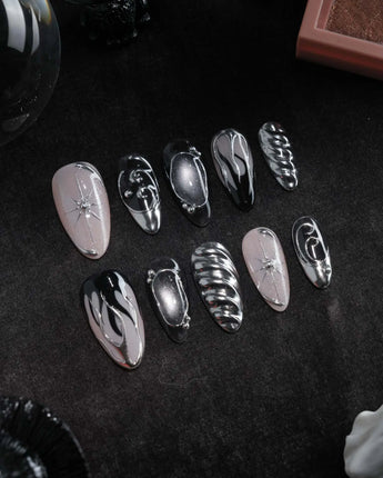 Mercury press on nails with sculpted mirror chrome swirls and outlines over smoke grey and black with a silver starburst on nude - image 3