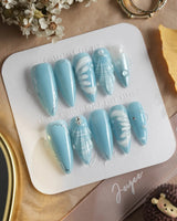 Mermaid Nail Designs Tale in medium stiletto shape with blue shell and wave nail art