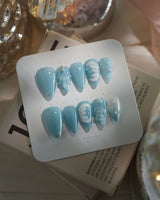Mermaid Nail Designs Tale in short stiletto shape with glossy sky blue shell art