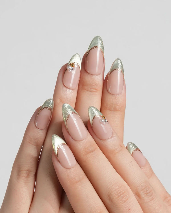 Metallic nude French nails with soft green shimmer