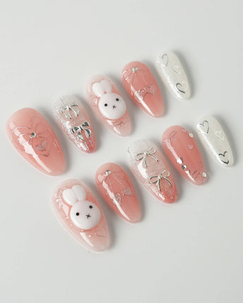 Miffy Sweetie press-on nails in medium almond shape — Sweet Pink-Orange, 3D Bunny & Silver Bows.