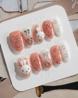 Miffy Sweetie press-on nails in medium oval shape — Sweet Pink-Orange, 3D Bunny & Silver Bows.
