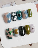 Mindbend artistic nails with surreal shapes, cool tones, and handcrafted 3D chrome accents