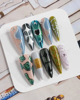 Mindbend handmade press-ons with cool earthy palette and sculptural abstract accents