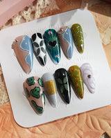Mindbend dreamlike press-on nails with earthy tones, raised accents, and retro geometry