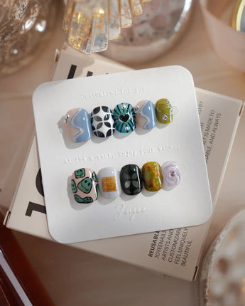 Mindbend extra short squoval nails with abstract retro art and 3D chrome texture