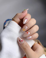 Mini Fruit glossy nude press-on nails with playful miniature fruit details