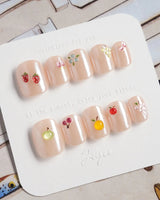 Mini Fruit extra short almond nail art with small berry and citrus accents