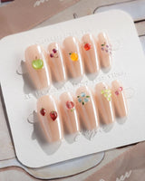 Mini Fruit playful minimalist nails with tiny 3D fruit pieces and glossy gel