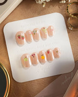 Mini Fruit summer press-on nails with tiny cherry and citrus gel pieces