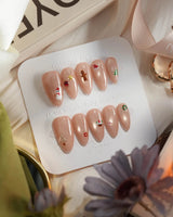 Mini Noel press-on nails — nude cat eye christmas icons handmade nail art by Joyee Nails