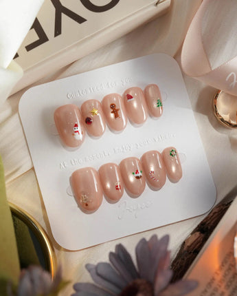 Mini Noel press-on nails — nude cat eye christmas icons handmade nail art by Joyee Nails