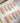 Minimal white holiday nails with cat-eye shimmer and star design