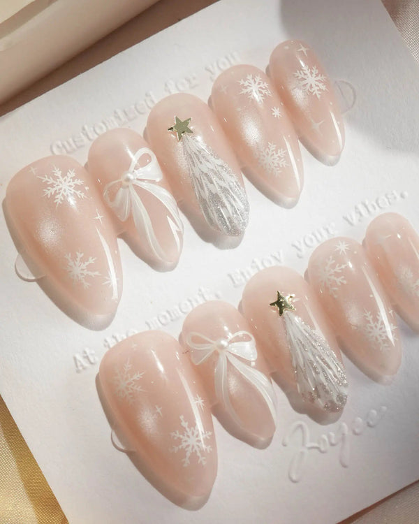 Minimal white holiday nails with cat-eye shimmer and star design