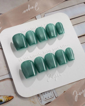 Mint Orb press-on nails in extra short coffin shape — Glacier Green Cat Eye