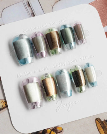 Mirrorplay handmade short oval nails with reflective square effects and shifting identity theme