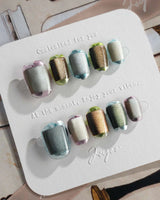 Mirrorplay reflective press-ons with sci-fi color blocks and shifting mirror-like gel polish