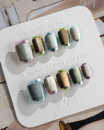 Mirrorplay reflective press-ons with sci-fi color blocks and shifting mirror-like gel polish