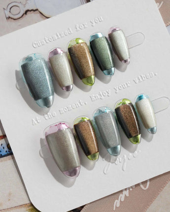 Mirrorplay hand-painted nails with metallic reflection blocks and short oval silhouette