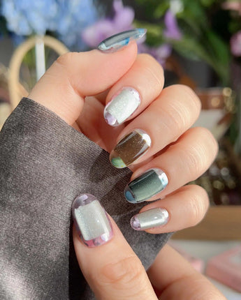 Mirrorplay handmade nails with mixed reflective moods and fluid sci-fi color shifts