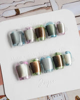Mirrorplay futuristic chrome nails with each nail showing a different reflective mood