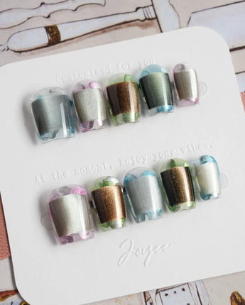 Mirrorplay futuristic chrome nails with each nail showing a different reflective mood