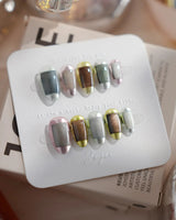 Mirrorplay extra short almond nails with colorful mirrored cat-eye squares and glossy chrome