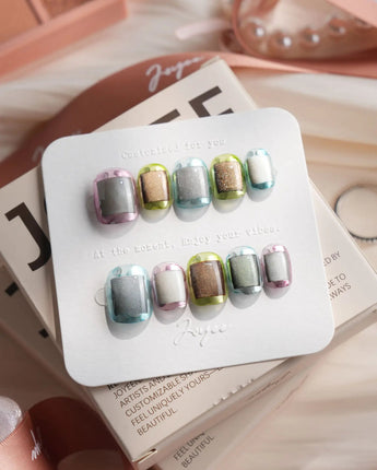 Mirrorplay extra short squoval nails with futuristic chrome, abstract panels, and cat-eye shine