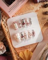 Miss Miffy press-on nails with nude base, silver metallic accents, 3D rabbit and cherry details