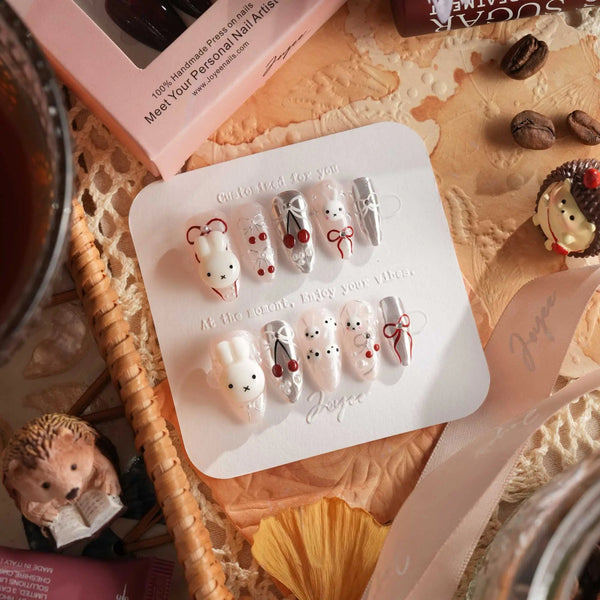 Miss Miffy press-on nails with nude base, silver metallic accents, 3D rabbit and cherry details