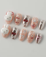Miss Miffy extra short almond press-on nails with nude base, 3D rabbit and cherry accents