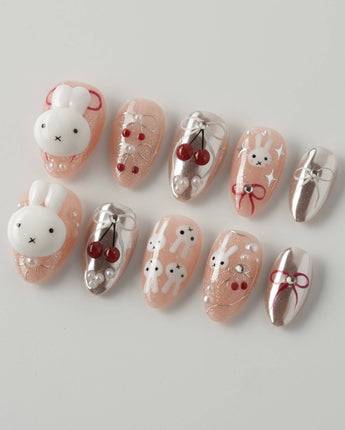 Miss Miffy extra short almond press-on nails with nude base, 3D rabbit and cherry accents